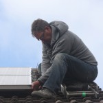 Trained Roofer Installing Clips and Mesh